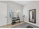 This is an exercise room with weights, fan, mirror, and plantation shutters at 6706 S Jacqueline Way, Gilbert, AZ 85298
