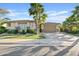 Charming single-story home featuring a well-manicured lawn, mature landscaping, and a spacious driveway at 6706 S Jacqueline Way, Gilbert, AZ 85298