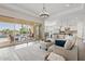 Open-concept living room with seamless transition to the kitchen and outdoor pool at 6706 S Jacqueline Way, Gilbert, AZ 85298