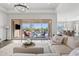 Spacious living room with sliding glass doors that open to the outdoor pool area at 6706 S Jacqueline Way, Gilbert, AZ 85298