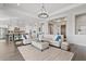 Spacious living room featuring wood floors and an open layout to the kitchen at 6706 S Jacqueline Way, Gilbert, AZ 85298