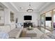 Comfortable living room with large TV and access to backyard pool area at 6706 S Jacqueline Way, Gilbert, AZ 85298