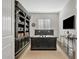 Home office with a large desk, custom shelving, and natural light, perfect for productivity at 6706 S Jacqueline Way, Gilbert, AZ 85298