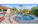 Inviting backyard pool with a baja step and mature landscaping at 6706 S Jacqueline Way, Gilbert, AZ 85298