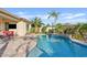 Backyard pool area featuring lush landscaping and a water feature at 6706 S Jacqueline Way, Gilbert, AZ 85298
