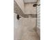 Featuring designer tile, the shower contains a shower head and glass block window to let in natural light at 6706 S Jacqueline Way, Gilbert, AZ 85298