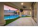 Covered backyard patio with ceiling fan overlooking the pool and spa, creating a relaxing outdoor living space at 7439 E Beryl Ave, Scottsdale, AZ 85258