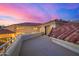Balcony view featuring the house's red tile roof and sunset views of the surrounding neighborhood at 7439 E Beryl Ave, Scottsdale, AZ 85258