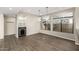 Stylish bar area featuring a built-in wine fridge, glass shelving, and ample counter space at 7439 E Beryl Ave, Scottsdale, AZ 85258