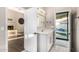 Bathroom with white vanity, bright lighting and access to the backyard at 7439 E Beryl Ave, Scottsdale, AZ 85258