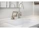 Bathroom sink with sleek brushed silver faucet and stone countertop at 7439 E Beryl Ave, Scottsdale, AZ 85258