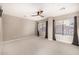 Bedroom with carpet, modern fan, and ample natural light at 7439 E Beryl Ave, Scottsdale, AZ 85258