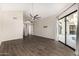 Large bedroom with fan, wood floors, and sliding glass doors to backyard pool at 7439 E Beryl Ave, Scottsdale, AZ 85258