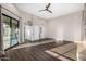 Spacious bedroom with wood-look tile flooring and natural light at 7439 E Beryl Ave, Scottsdale, AZ 85258