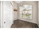 Cozy room featuring wood floors, a ceiling fan, and a bright window at 7439 E Beryl Ave, Scottsdale, AZ 85258