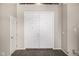 Front entryway featuring double doors, wood floors, and neutral color palette at 7439 E Beryl Ave, Scottsdale, AZ 85258