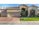 Charming home exterior with well-maintained landscaping and two-car garage at 7439 E Beryl Ave, Scottsdale, AZ 85258