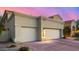 Exterior of three car garage with desert landscaping at 7439 E Beryl Ave, Scottsdale, AZ 85258