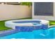 Outdoor hot tub surrounded by artificial grass, perfect for relaxation and enjoyment at 7439 E Beryl Ave, Scottsdale, AZ 85258
