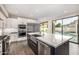 Kitchen island and stainless appliances with a view of the pool at 7439 E Beryl Ave, Scottsdale, AZ 85258