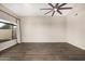 Spacious living room features wood floors, bright lighting, and backyard views at 7439 E Beryl Ave, Scottsdale, AZ 85258