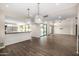 Open living room with bar seating, backyard access, high ceilings, and tile floors at 7439 E Beryl Ave, Scottsdale, AZ 85258