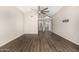 This spacious living room has wood floors, high ceilings, and neutral color palette at 7439 E Beryl Ave, Scottsdale, AZ 85258