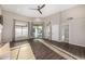 Living room with wood-look tile, lots of natural light, and backyard views at 7439 E Beryl Ave, Scottsdale, AZ 85258