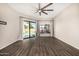 Bright living room boasts sliding glass doors to the pool and light-filtering curtains at 7439 E Beryl Ave, Scottsdale, AZ 85258