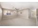 Spacious loft area with carpet, ceiling fan, and natural light at 7439 E Beryl Ave, Scottsdale, AZ 85258