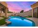 Stunning backyard pool with adjacent spa and lush landscaping features at 7439 E Beryl Ave, Scottsdale, AZ 85258