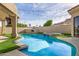 Backyard pool featuring an attached hot tub, a deck, and a tanning ledge at 7439 E Beryl Ave, Scottsdale, AZ 85258