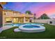 Captivating backyard pool and spa with string lights and covered patio view at 7439 E Beryl Ave, Scottsdale, AZ 85258