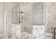 Modern shower with glass surround and marble accents, featuring a rainfall shower head at 7439 E Beryl Ave, Scottsdale, AZ 85258