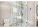 Bathroom with modern shower, bench and white tile at 7439 E Beryl Ave, Scottsdale, AZ 85258