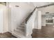 Carpeted staircase with black railing and neutral walls providing access to upper levels at 7439 E Beryl Ave, Scottsdale, AZ 85258