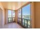A private balcony overlooks the city with decorative balustrades and sliding glass doors at 7970 E Camelback Rd # 604, Scottsdale, AZ 85251