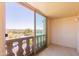 An outdoor balcony offers city views with decorative balustrades and sliding glass doors at 7970 E Camelback Rd # 604, Scottsdale, AZ 85251