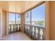A private balcony overlooks the city with decorative balustrades and sliding glass doors at 7970 E Camelback Rd # 604, Scottsdale, AZ 85251