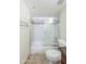 Bathroom featuring a shower-over-tub with a sliding glass door and mosaic tile accent at 7970 E Camelback Rd # 604, Scottsdale, AZ 85251