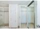 Bathroom featuring a glass-door shower, white cabinets, and mirrored closet doors at 7970 E Camelback Rd # 604, Scottsdale, AZ 85251