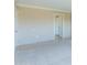 Spacious, carpeted bedroom with neutral walls, white trim and tile floors near the door at 7970 E Camelback Rd # 604, Scottsdale, AZ 85251