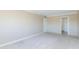 Spacious, carpeted bedroom with neutral walls, white trim and tile floors near the door at 7970 E Camelback Rd # 604, Scottsdale, AZ 85251