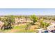 Expansive view of property showcasing mature trees and landscaping, and a nearby roadway with mountain backdrop at 7970 E Camelback Rd # 604, Scottsdale, AZ 85251