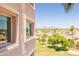 Partial view of the community building and expansive landscaped areas, including mature trees and green lawns at 7970 E Camelback Rd # 604, Scottsdale, AZ 85251