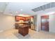 A modern kitchen features stainless steel appliances, a kitchen island, and a stylish backsplash at 7970 E Camelback Rd # 604, Scottsdale, AZ 85251