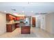 Updated kitchen features stainless steel appliances, center island, and an eat-in dining area at 7970 E Camelback Rd # 604, Scottsdale, AZ 85251