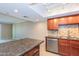 Spacious kitchen features stainless steel appliances and granite countertops at 7970 E Camelback Rd # 604, Scottsdale, AZ 85251