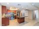 Updated kitchen features stainless steel appliances, center island, and an eat-in dining area at 7970 E Camelback Rd # 604, Scottsdale, AZ 85251
