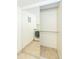 A well-lit laundry room features tile flooring, a mirrored door, and washer dryer units at 7970 E Camelback Rd # 604, Scottsdale, AZ 85251